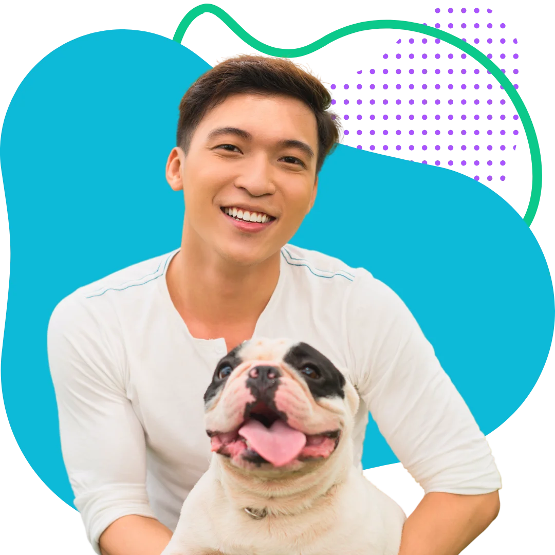 man sitting happily with his emglish bulldog with a colorful abstract background