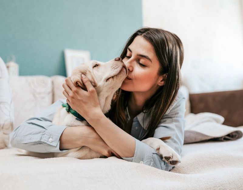 Woman holding a puppy